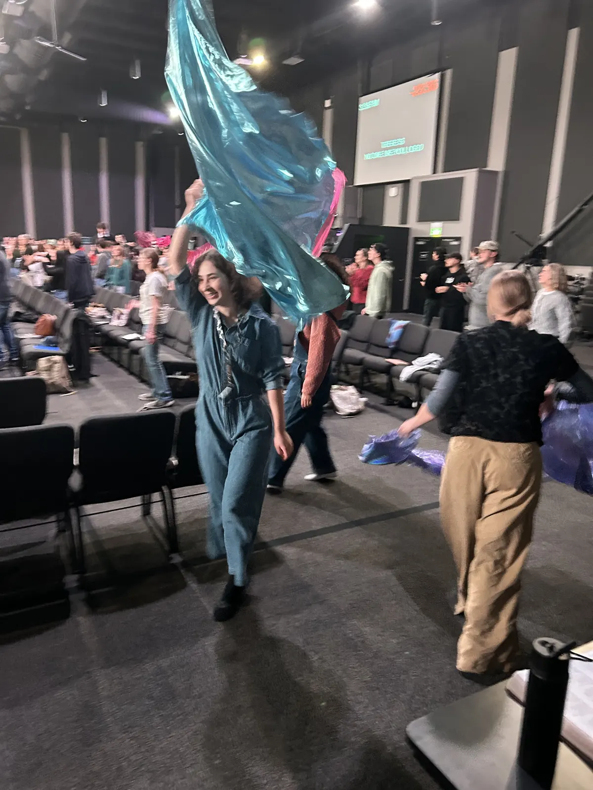 Vera carrying a ministry flag during a BSSM gathering.