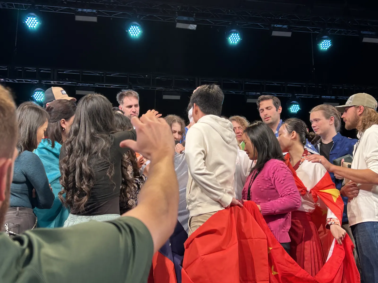 People praying together during a BSSM ministry gathering.
