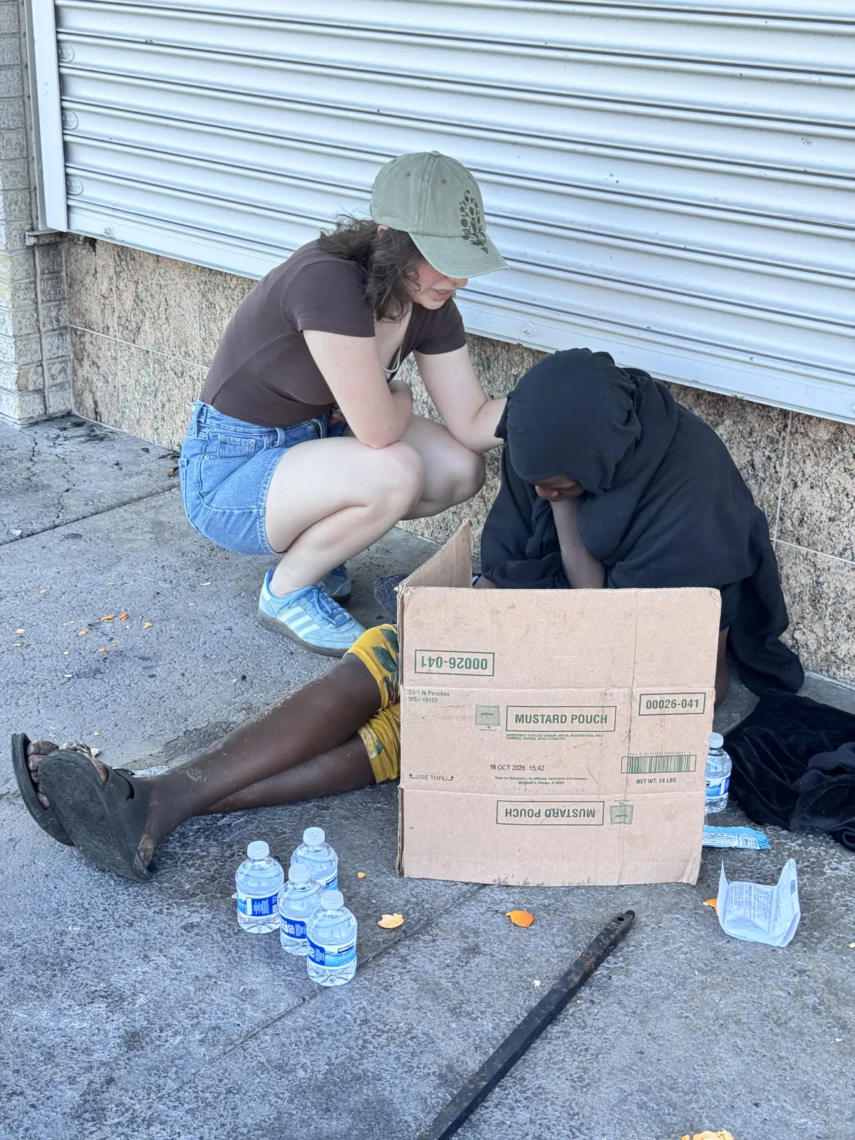 Vera listening to someone during street outreach in Stockton.